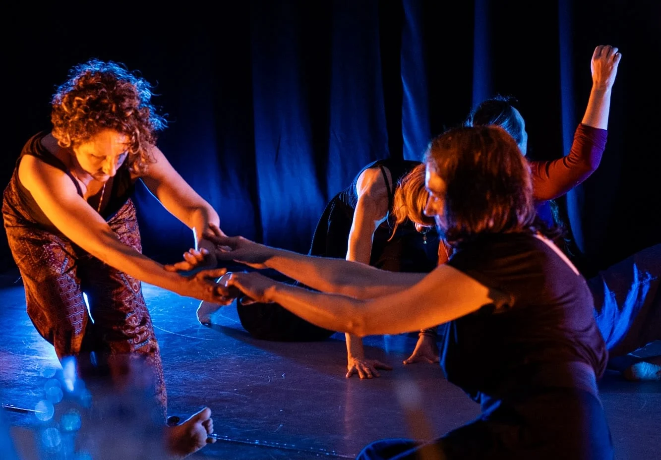 people dancing around in a circle